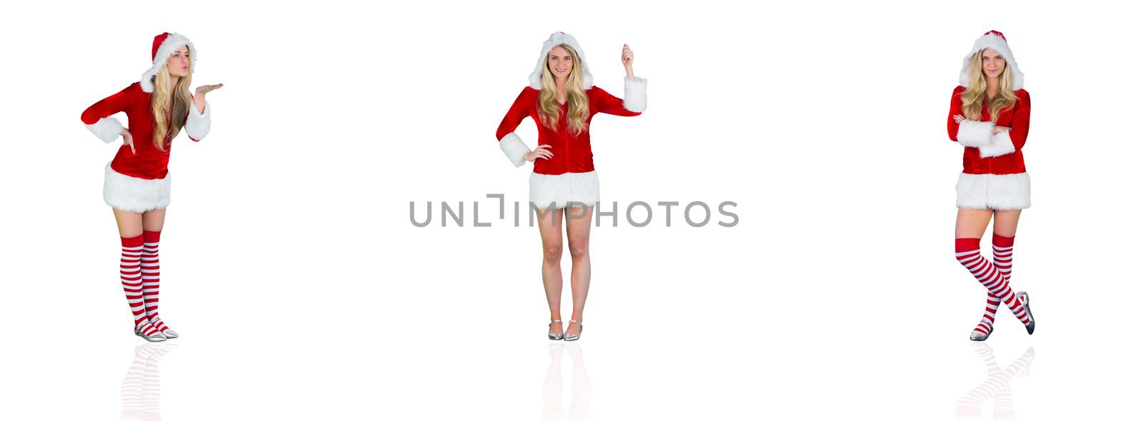 Composite image of pretty girl in santa outfit blowing by Wavebreakmedia