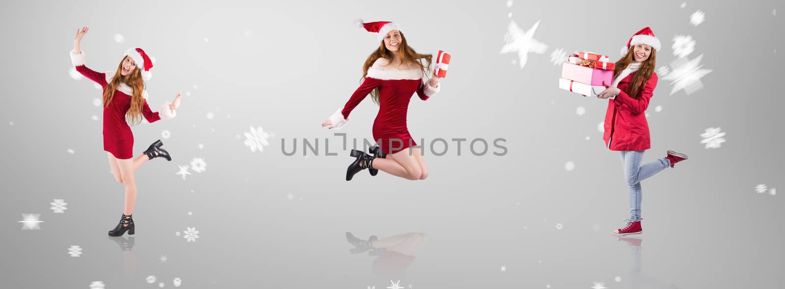 Composite image of festive redhead smiling at camera by Wavebreakmedia