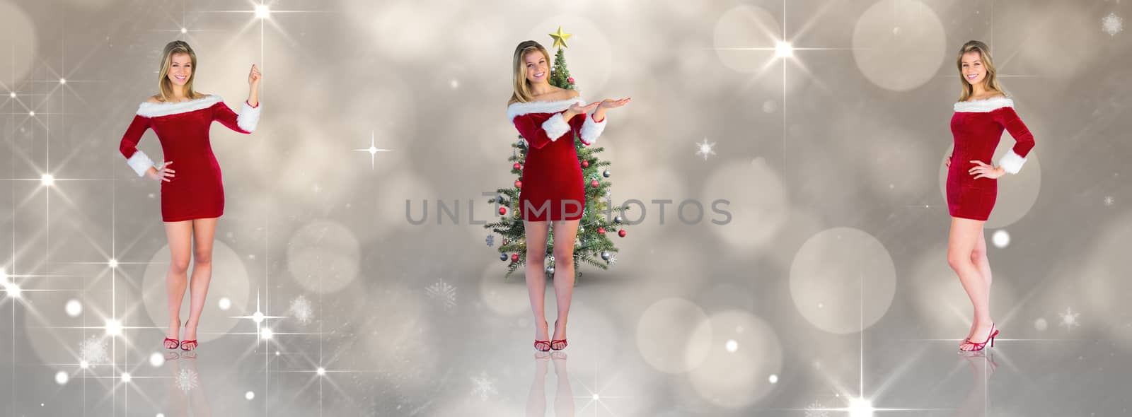 Pretty girl smiling in santa outfit against shimmering light design on grey