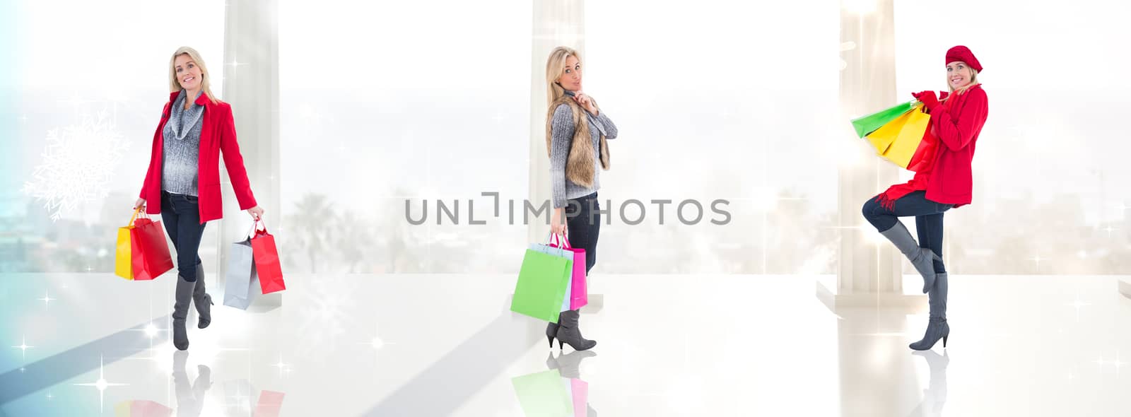 Happy blonde in winter clothes holding shopping bags against twinkling lights over balcony with columns
