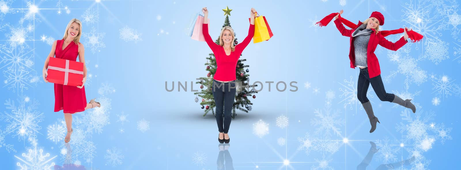 Happy blonde holding shopping bags against white snowflake design on blue