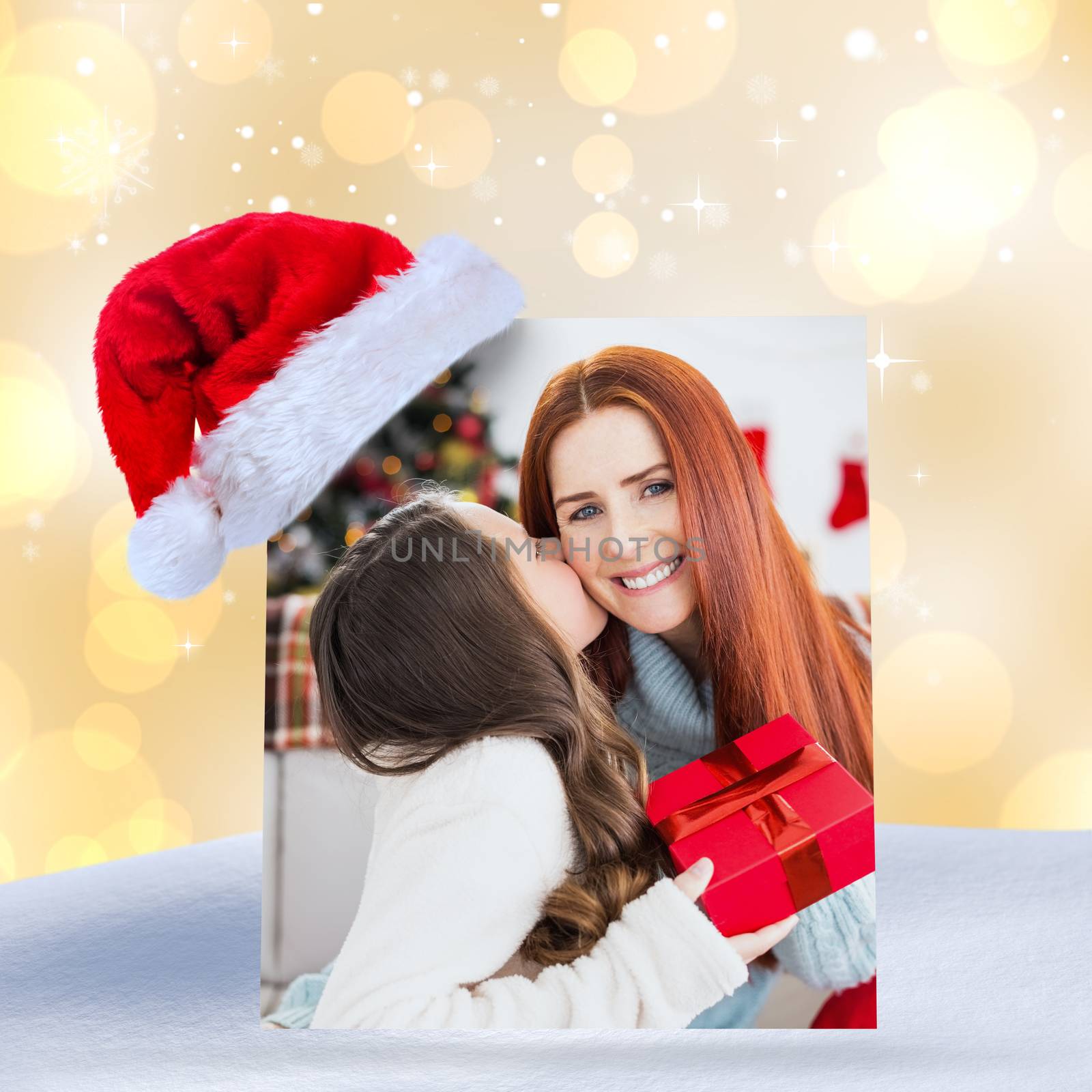 Composite image of daughter giving her mother a christmas present by Wavebreakmedia
