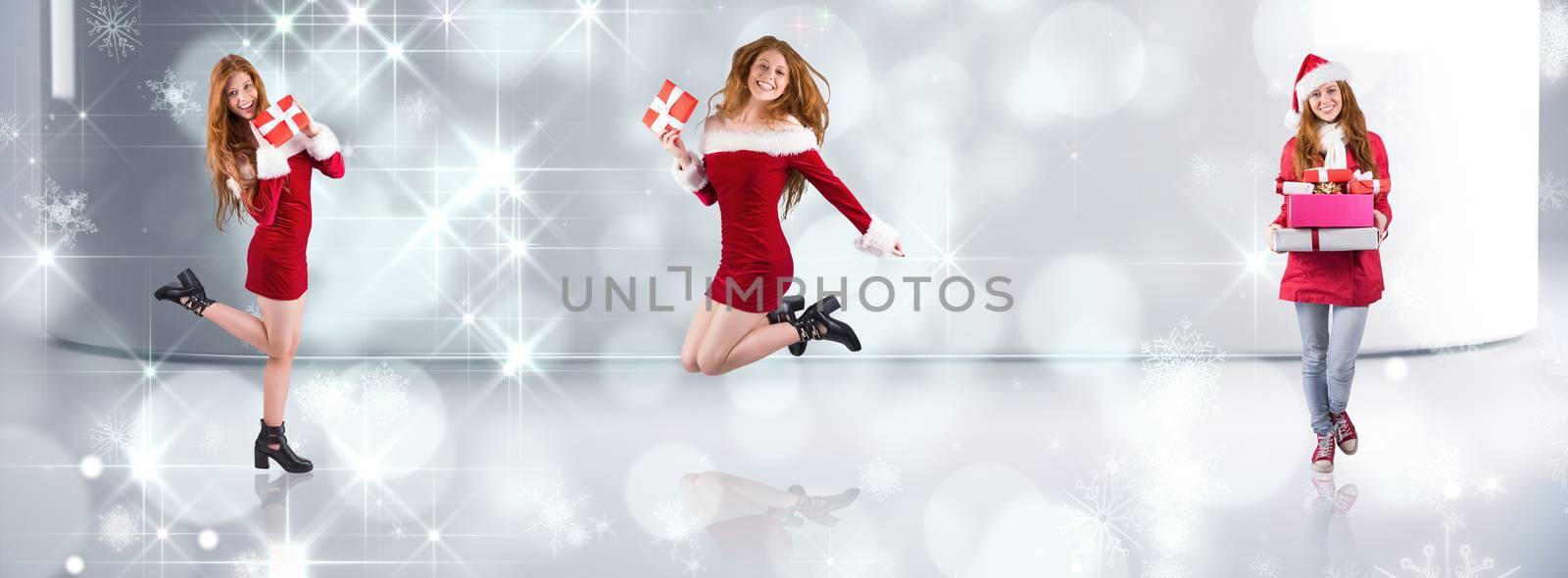 Festive redhead holding a gift against lights twinkling in modern room