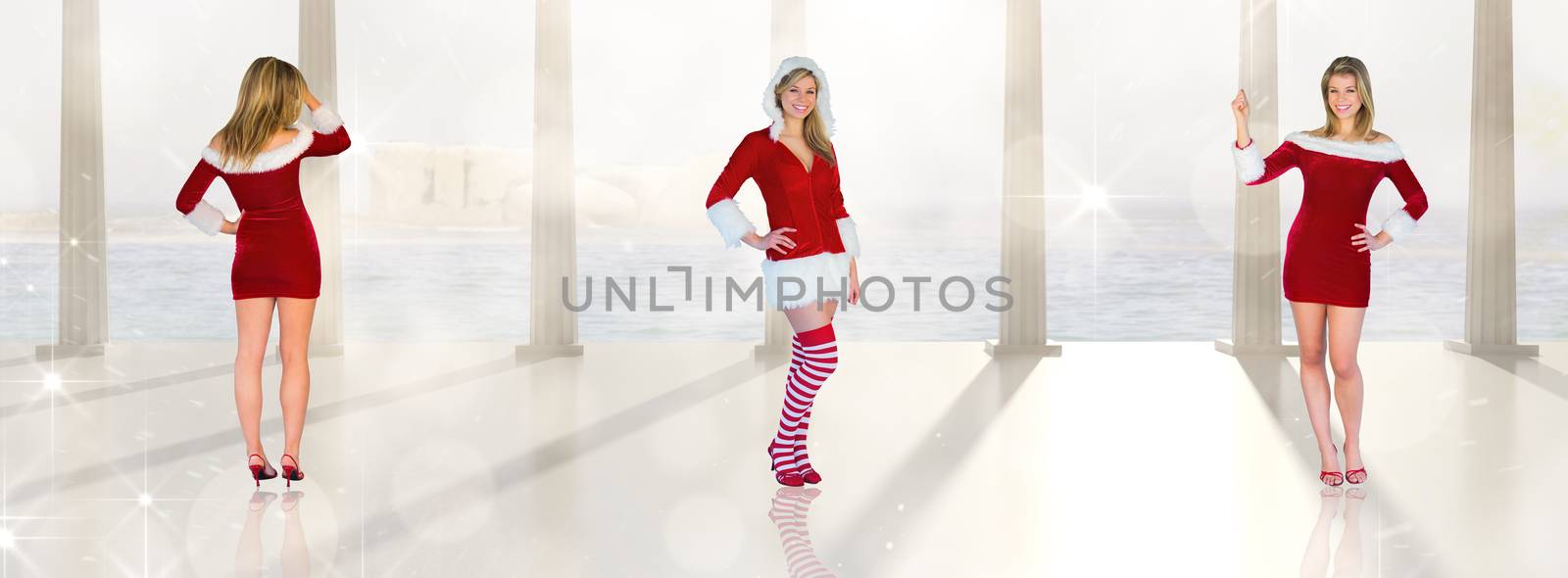 Composite image of pretty girl smiling in santa outfit by Wavebreakmedia