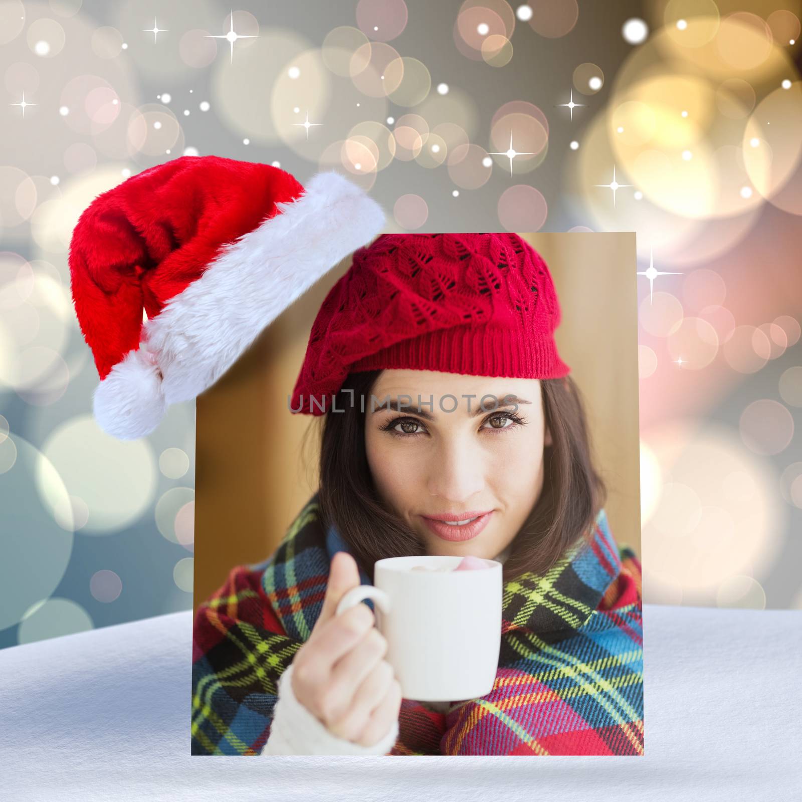 Brunette with cover holding mug against light glowing dots design pattern