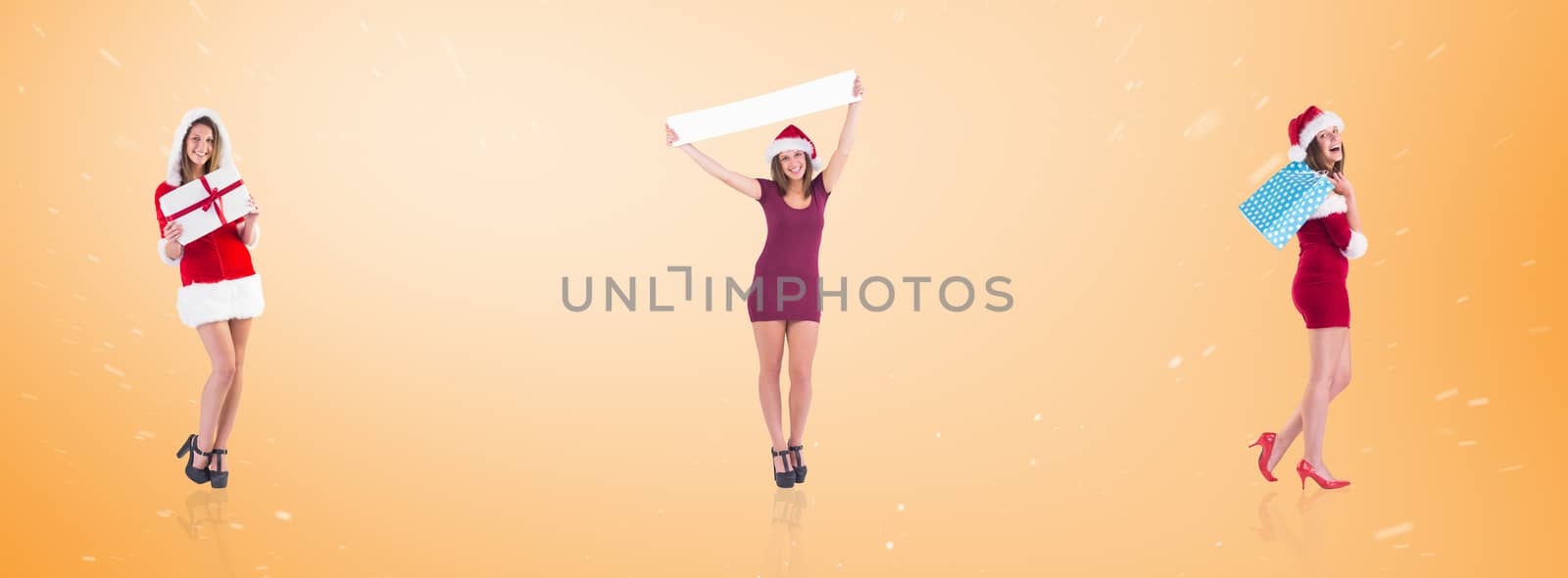 Festive brunette holding shopping bags against orange vignette