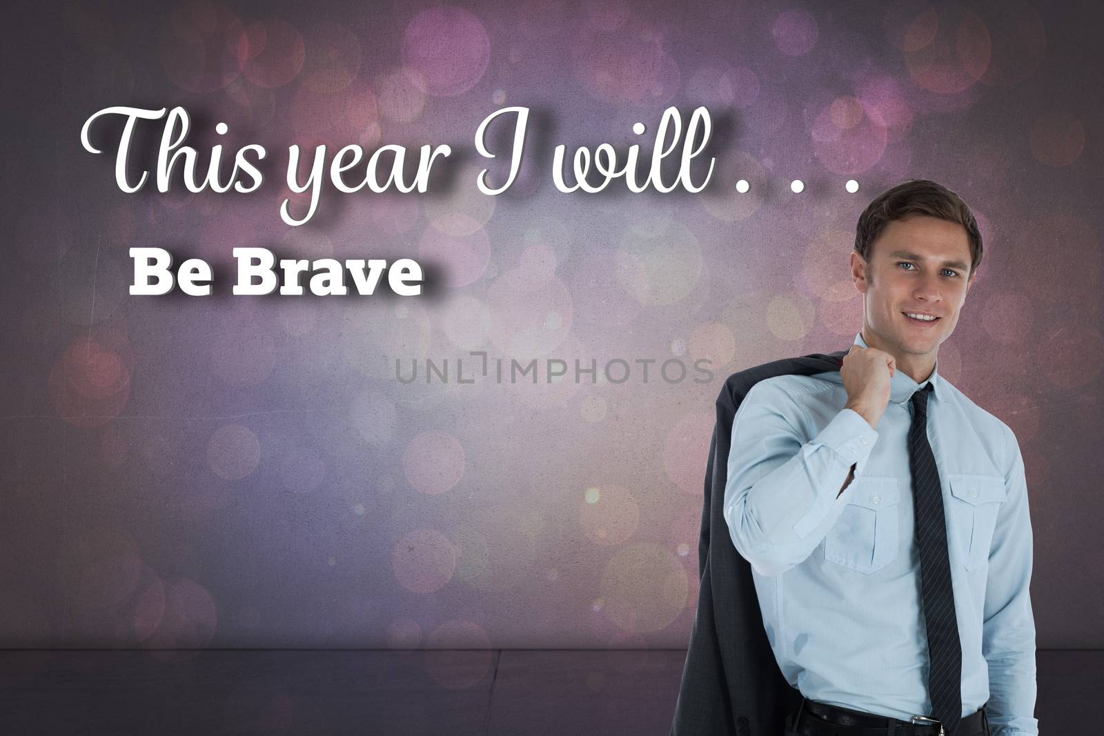 Smiling businessman holding his jacket against purple abstract light spot design