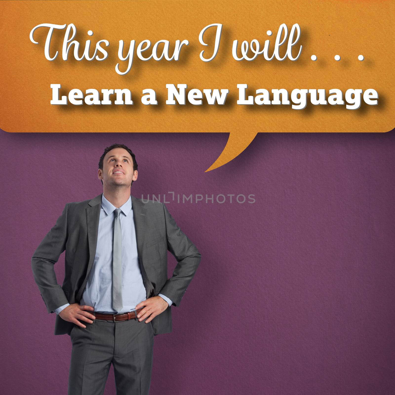 Smiling businessman with hands on hips against purple vignette