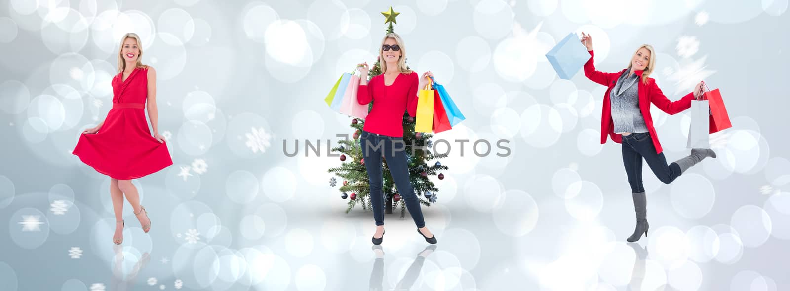 Composite image of happy blonde holding shopping bags by Wavebreakmedia