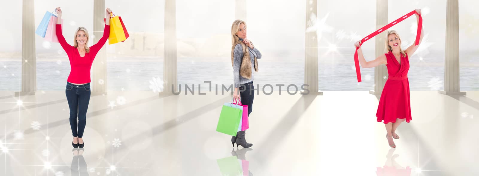 Happy blonde holding shopping bags against twinkling lights over balcony with columns