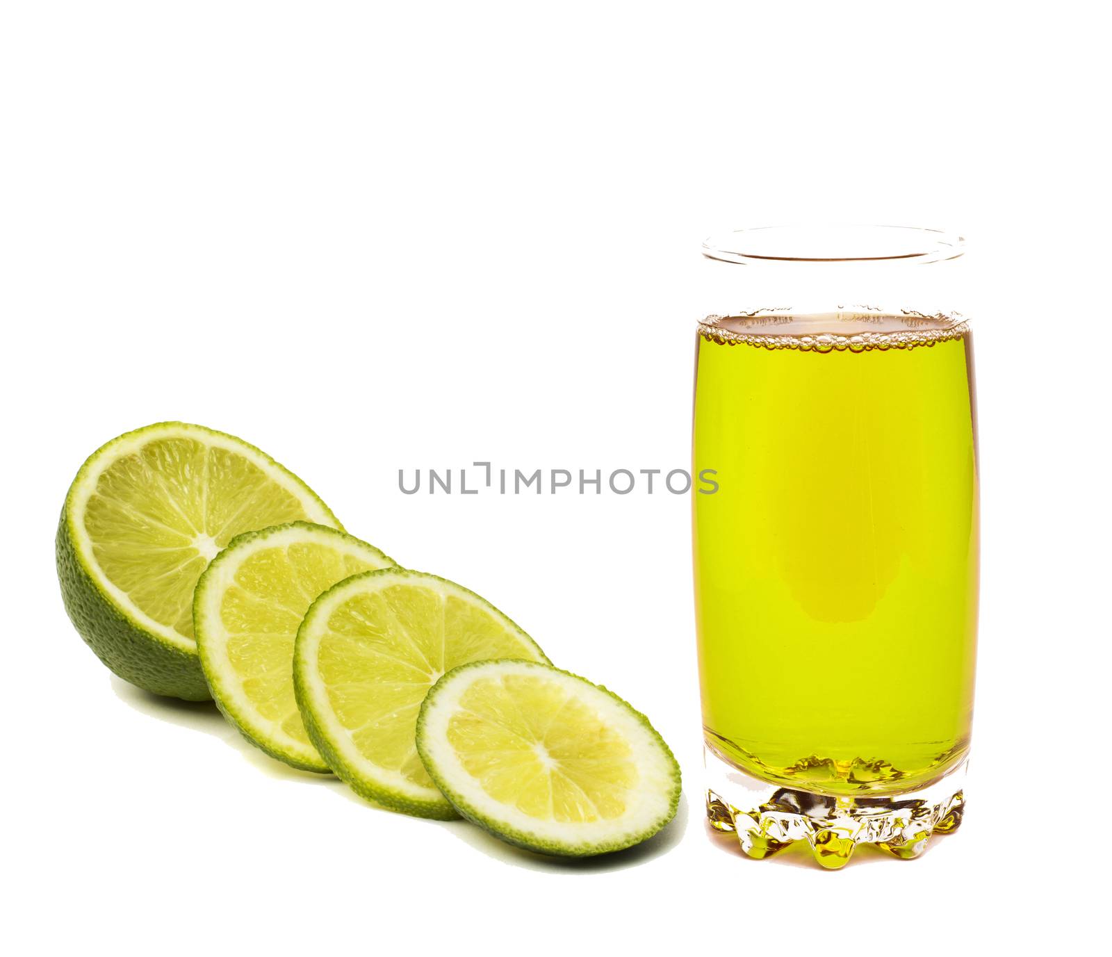 Lime juice in glass with lime slices by ozaiachin
