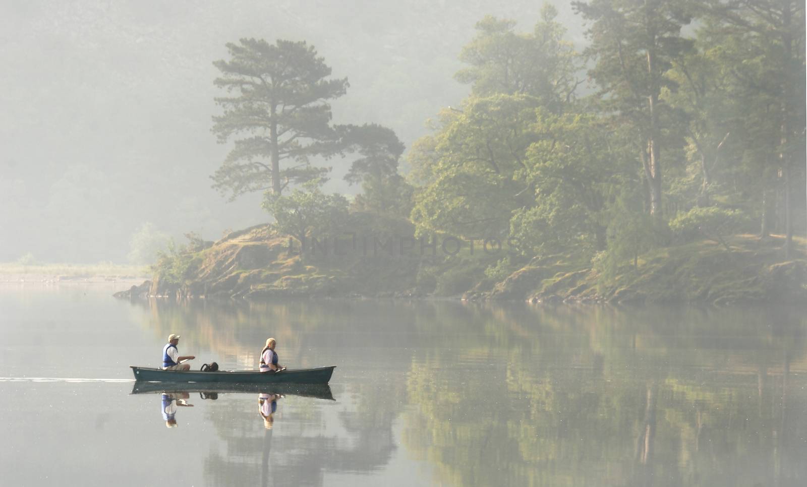 A misty morning on Lake Derwent in the Lake District Cumbria, England.