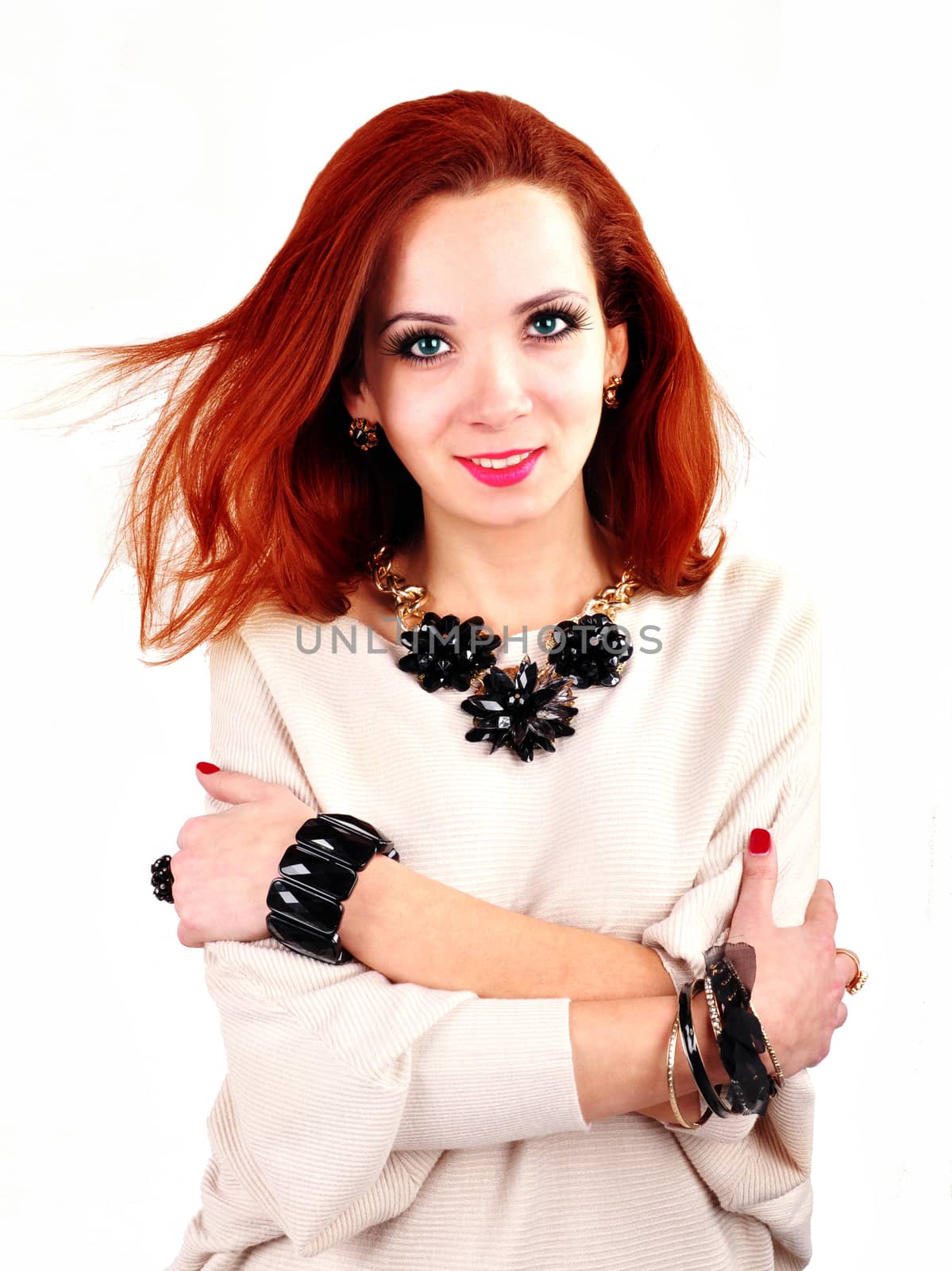 young girl advertises a set of jewelry on a white background