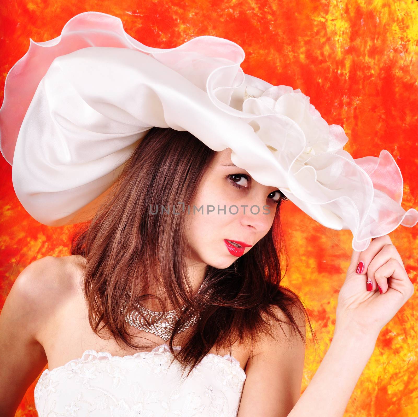 young girl in a wedding dress and hat