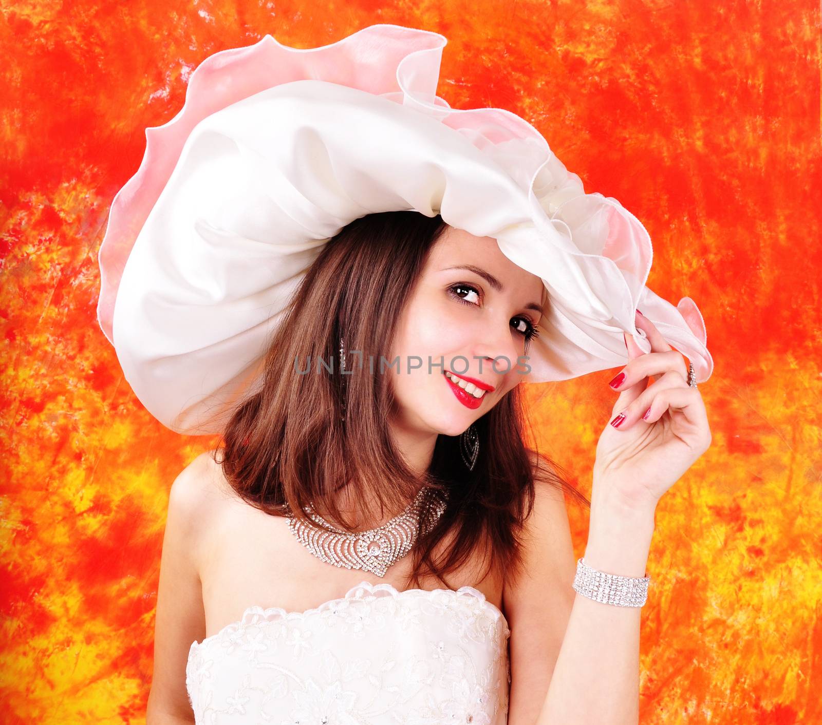 young girl in a wedding dress and hat