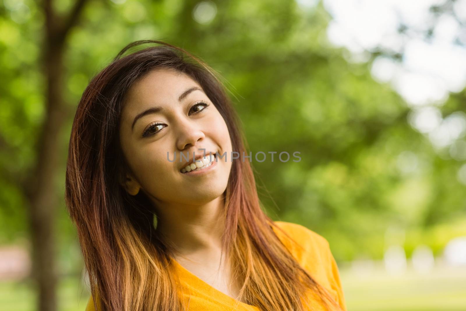 Close up portrait of beautiful young woman outdoors