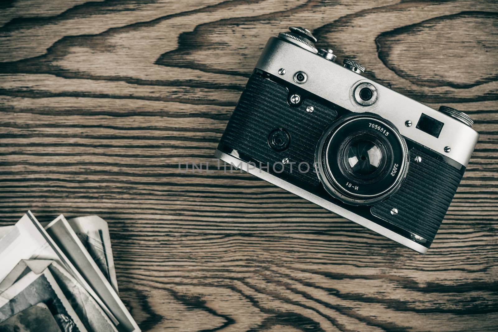 old camera and old pictures wooden table