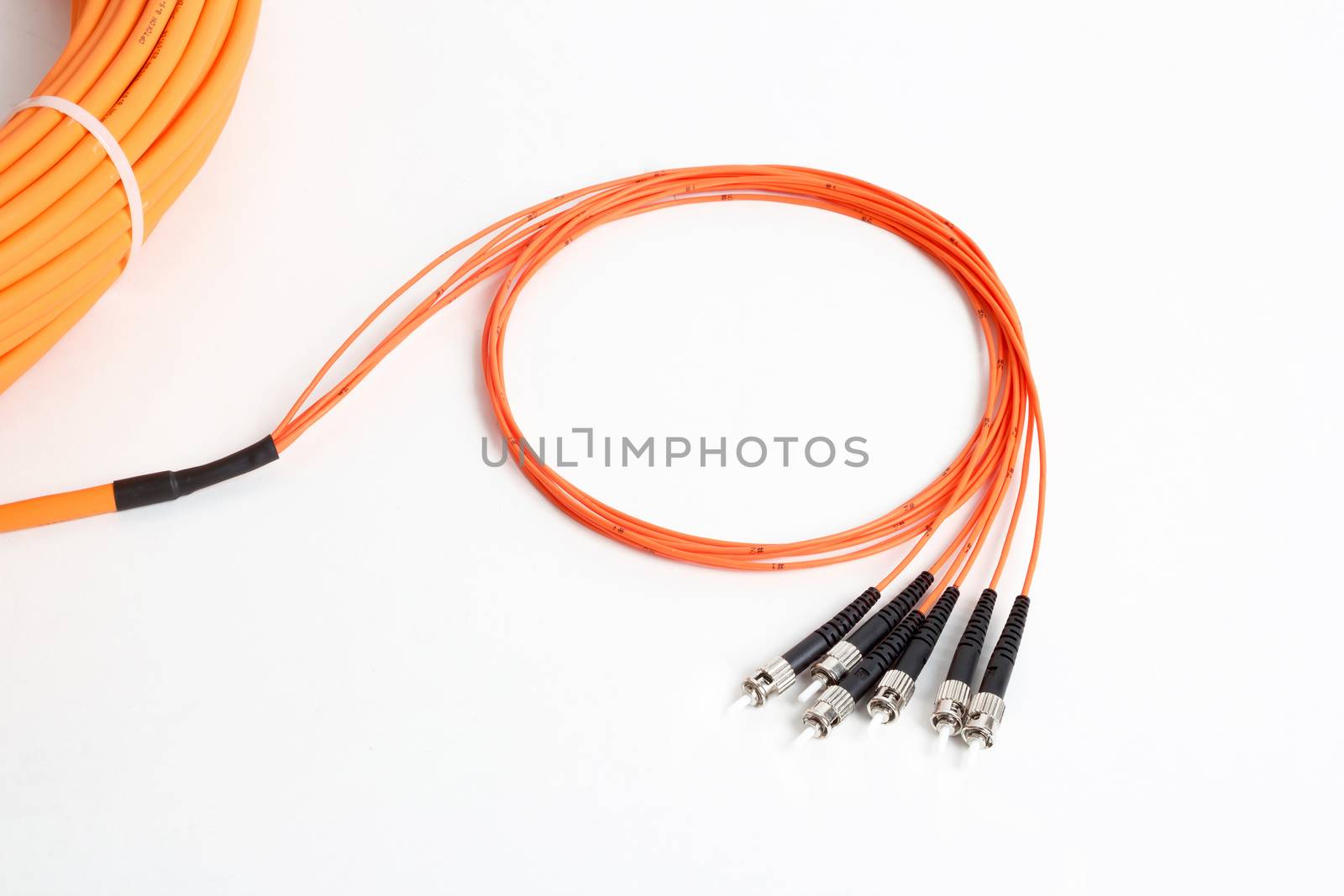 group of fiber optic ST connectors on orange patchcord 