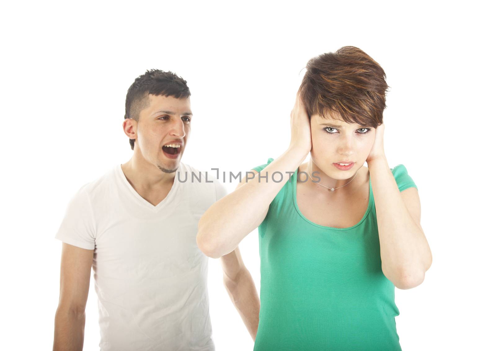 Young man shouting at young woman isolated on white background by gigra