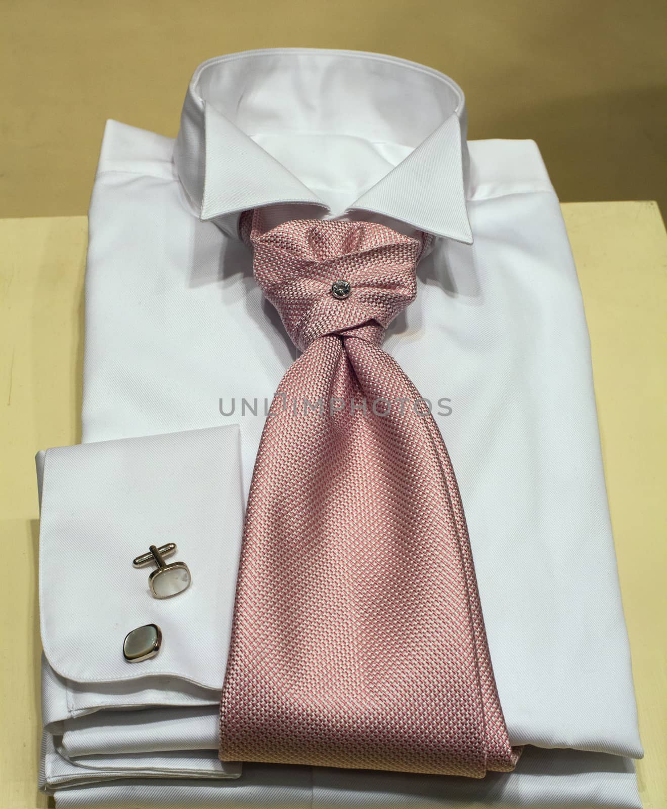 Close up of white male shirts exposed in the clothes shop