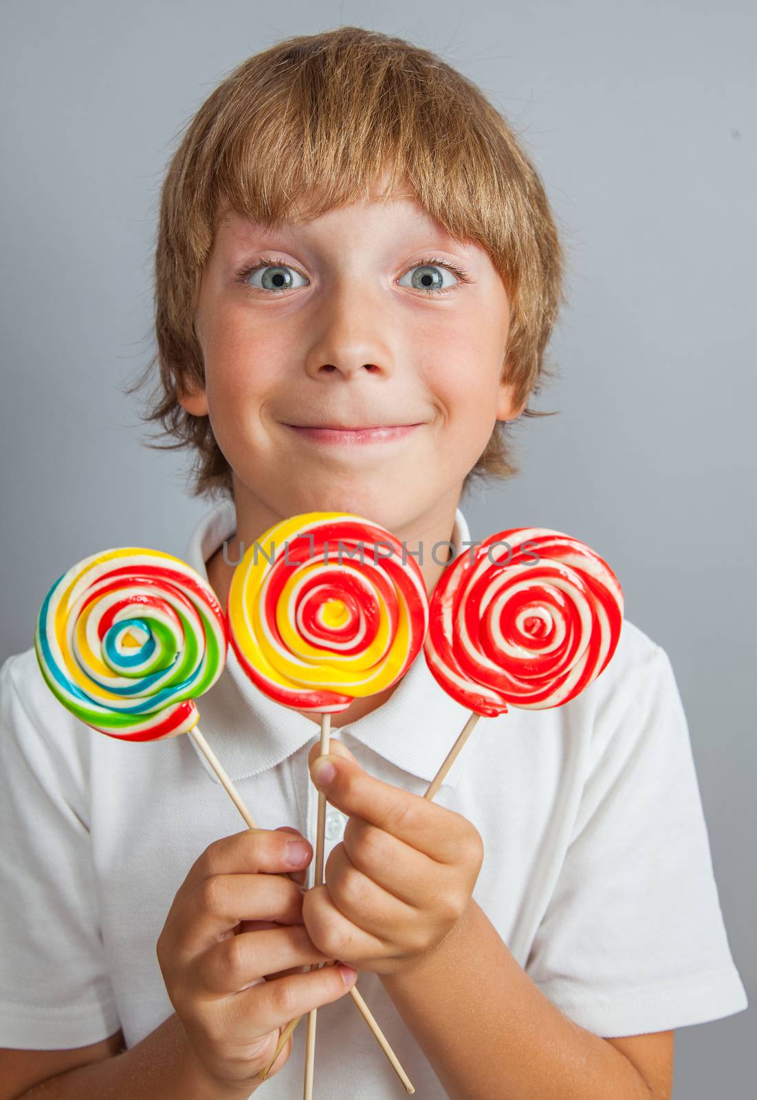 child boy eating lollipop by anelina