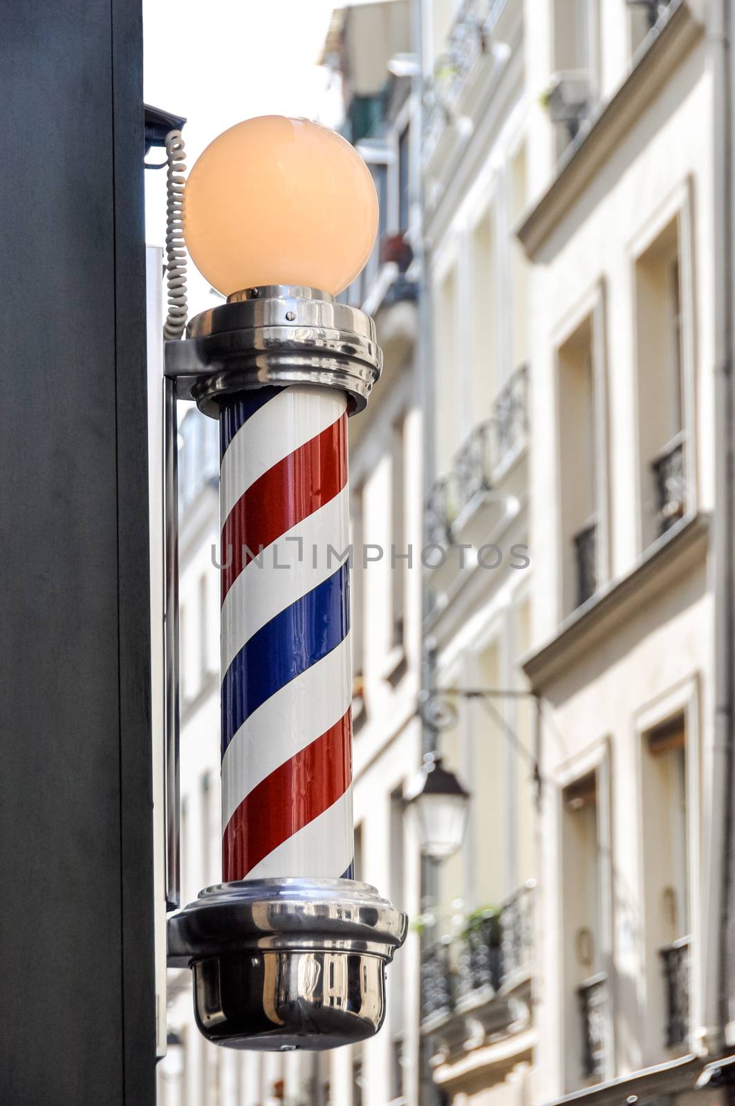 Barber shop sign in Paris by dutourdumonde