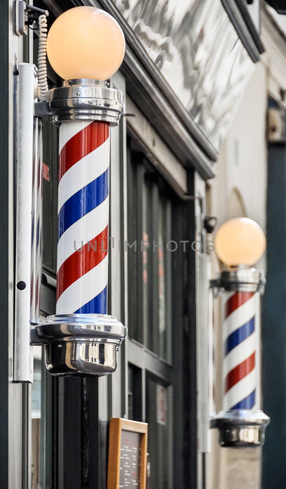 Barber shop sign in Paris by dutourdumonde
