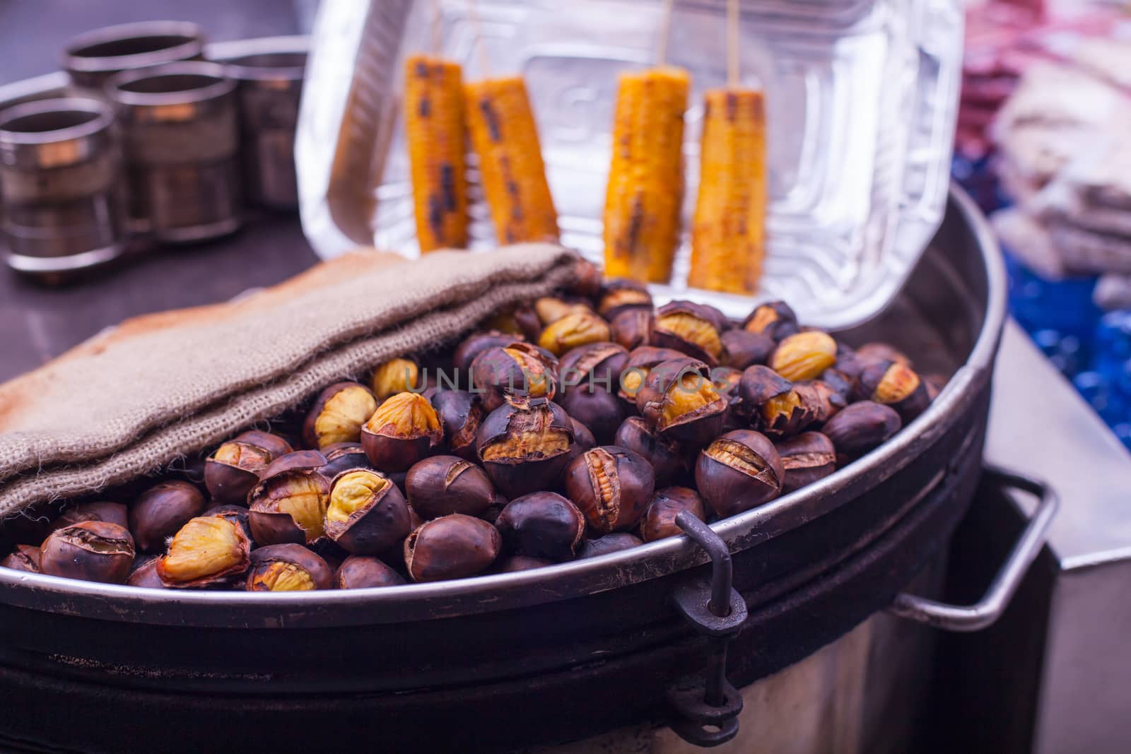 Freshly roasted chestnuts inside a iron plate