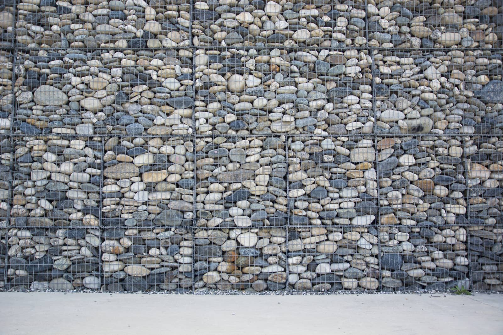 Empty wall made of stones and concrete pavement by artofphoto