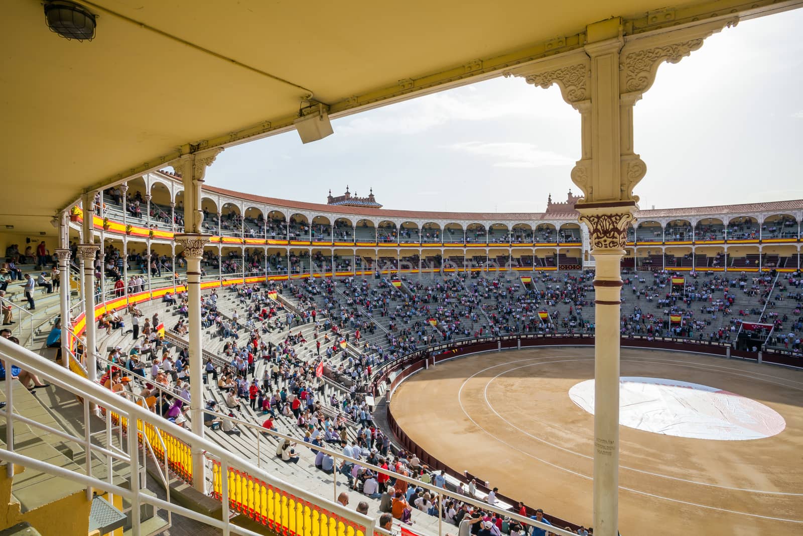 Madrid, Spain - May 11, 2012: Plaza de Toros de Las Ventas interior view with tourists gathering for the bull show in Madrid on a sunny day, Spain