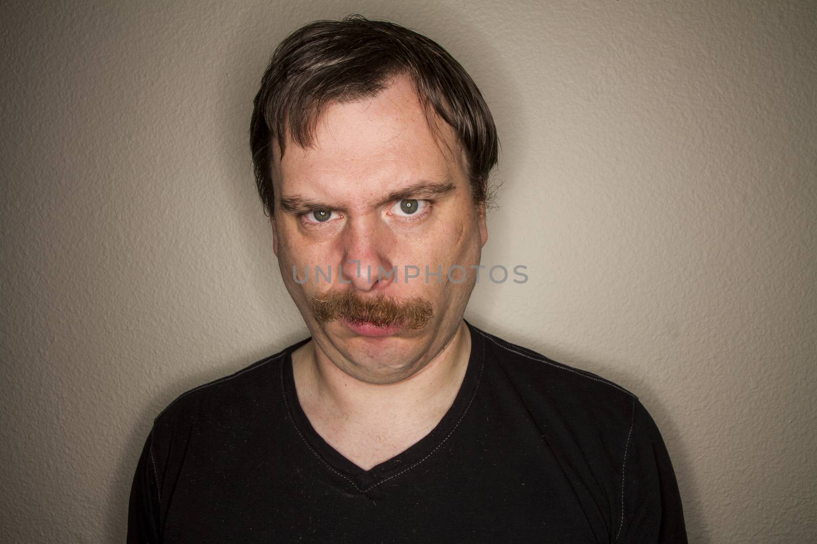 funny looking guy is not impressed with what he is looking at
