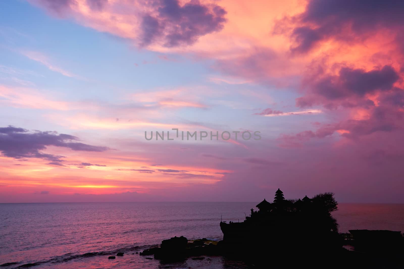 sunset over hindu temple Tanah Lot, Bali, Indonesia