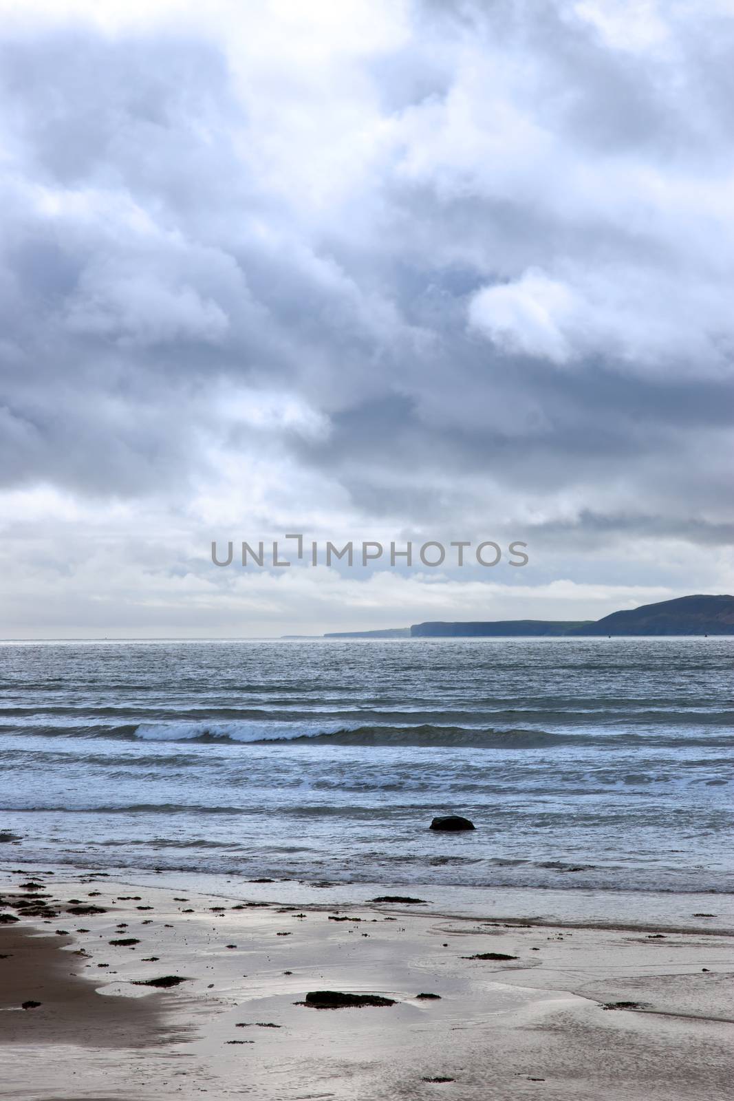 stormy rocky beal beach by morrbyte