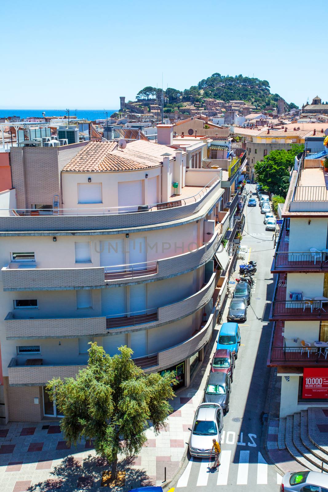 Spain, Catalunya, Tossa de Mar, 06.20.2013, the panorama of the town with the Carrer Tomas Barber street and the Mediterranean Sea with the old medieval fortress Villa Vella, editorial use only