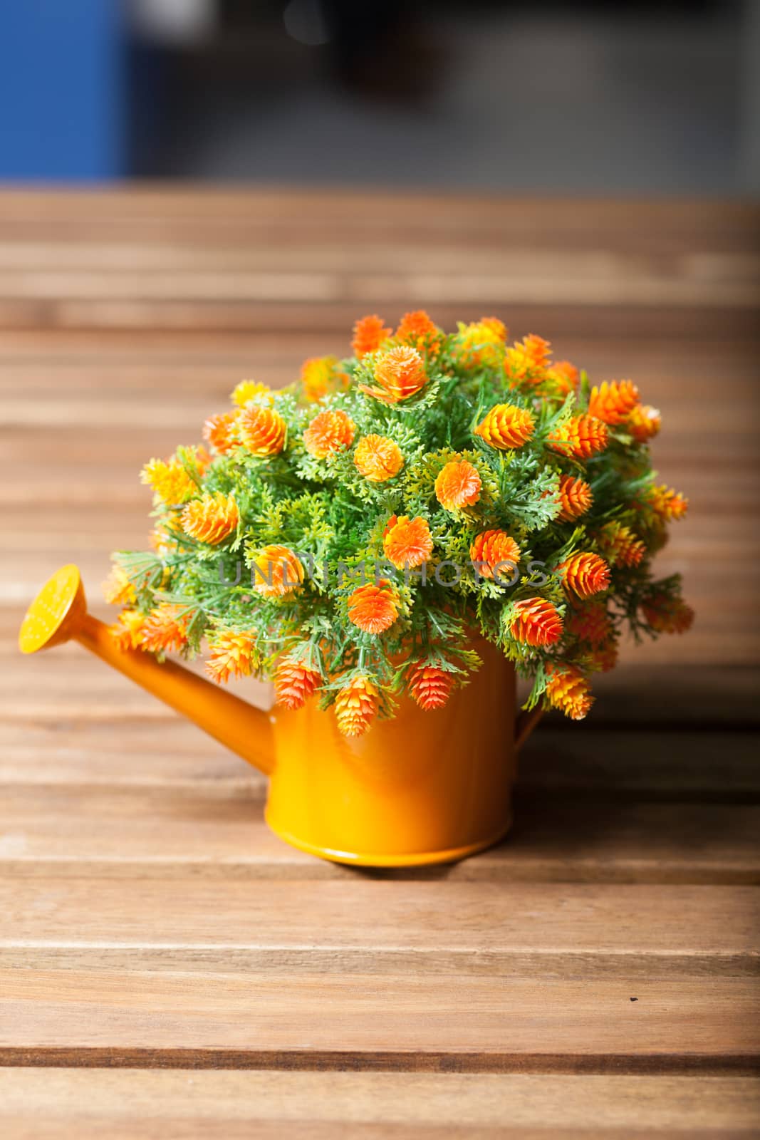 Vase flower pot. Placed on a table made of wood inside the house.