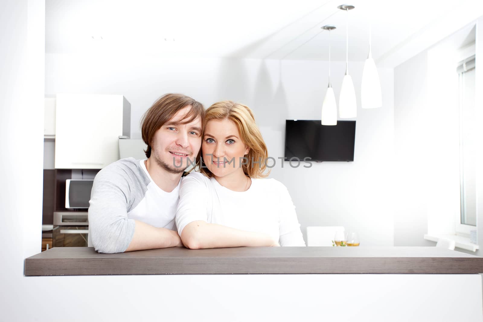 Smiiling Couple Relaxing In New Home