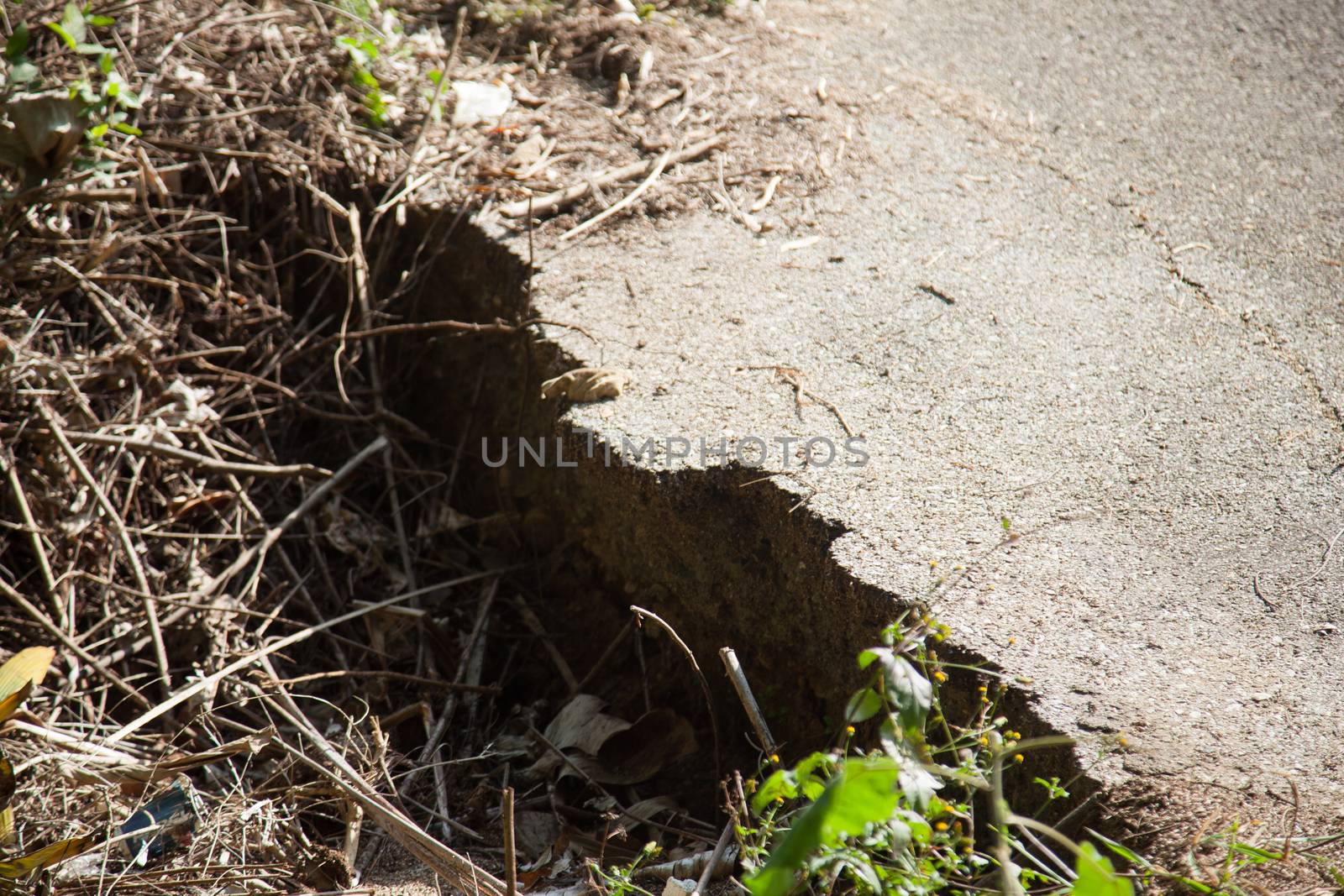 Road broken. The condition of the road with a broken floor of a dilapidated.