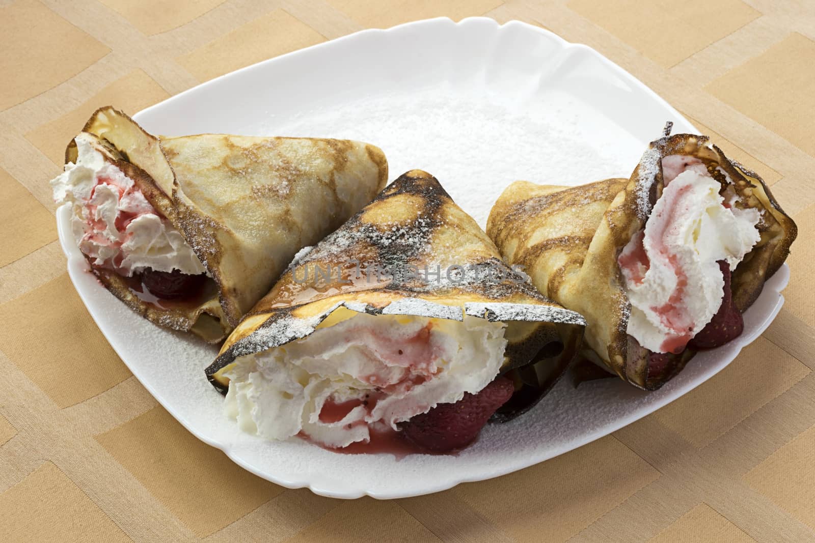 Pancakes with strawberries and cream