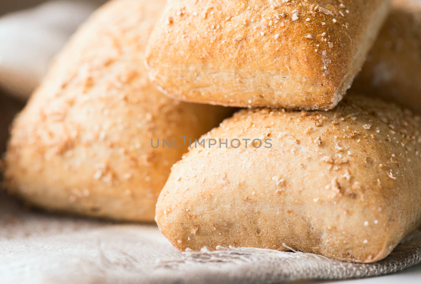 Oven baked bread on napkin. Selective focus. Shallow DOF