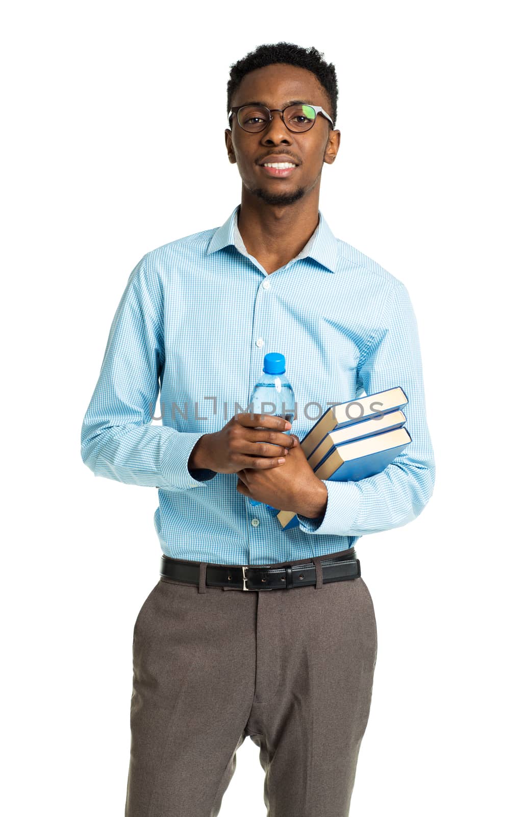 Happy african american college student standing with books in his hands on white background