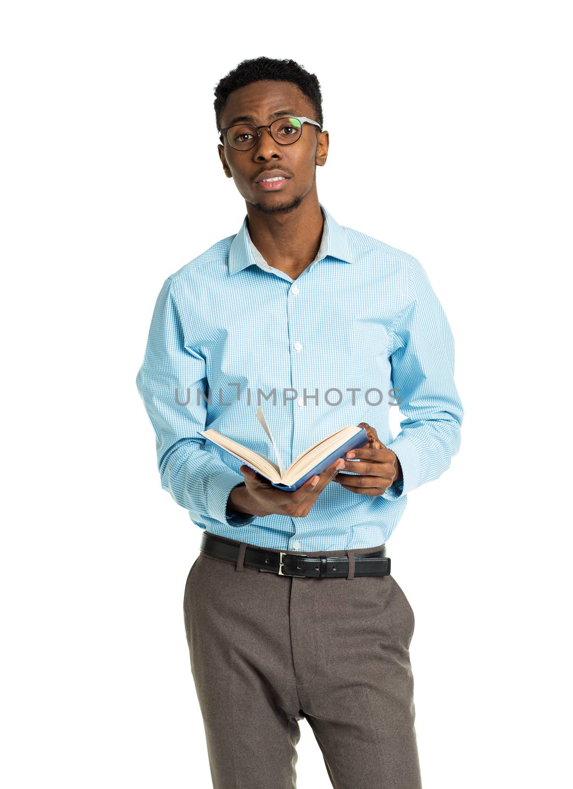 Happy african american college student standing with book in his hands on white background