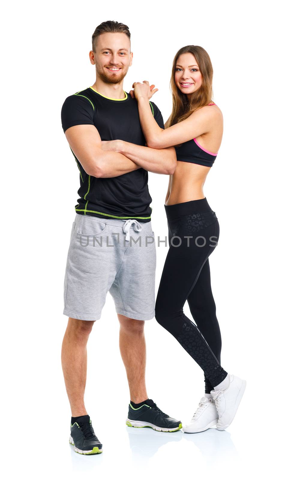 Sport couple - man and woman after fitness exercise on the white background