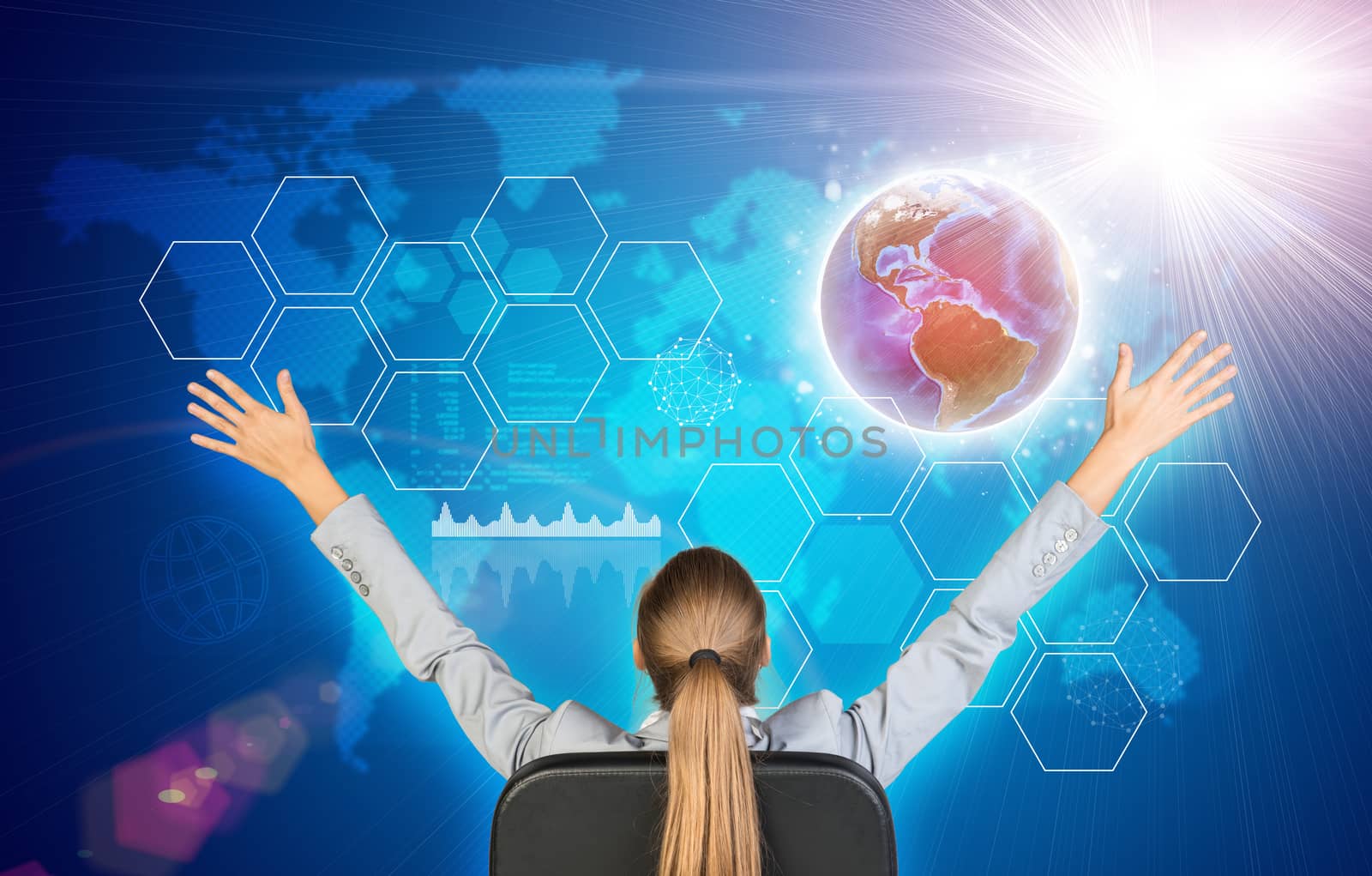 Businesswoman sitting on office chair with her hands outstretched. Earth, world map, light and hexagons as backdrop. Element of this image furnished by NASA