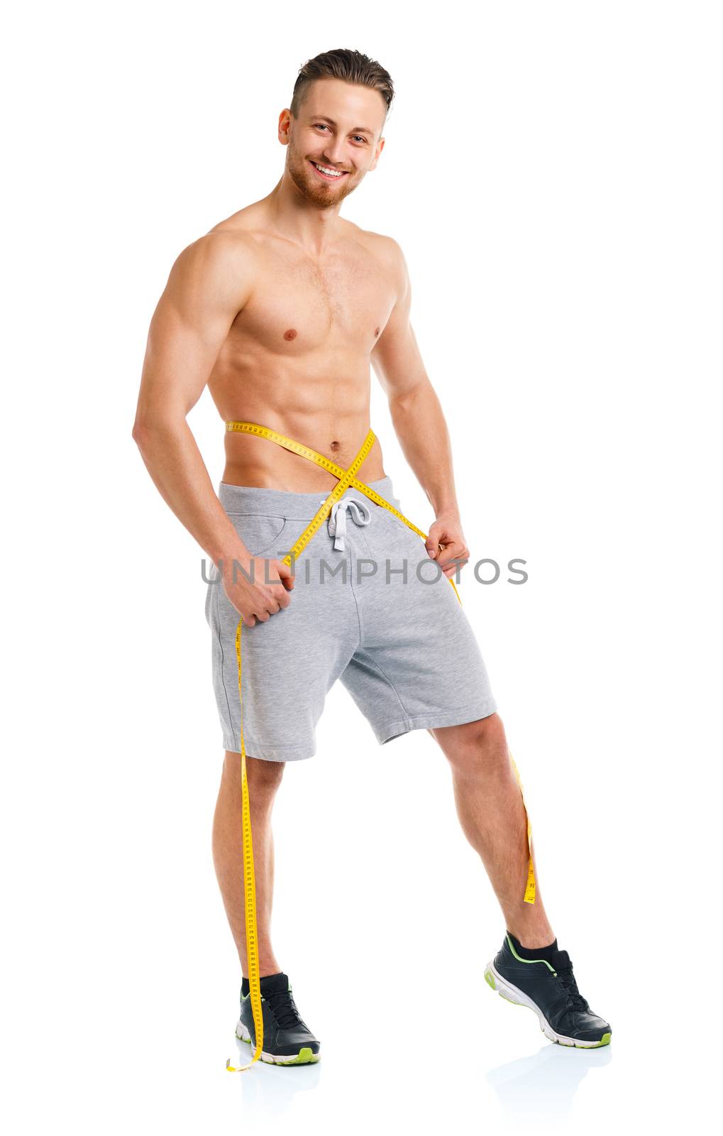 Sport man with measuring tape on the white background