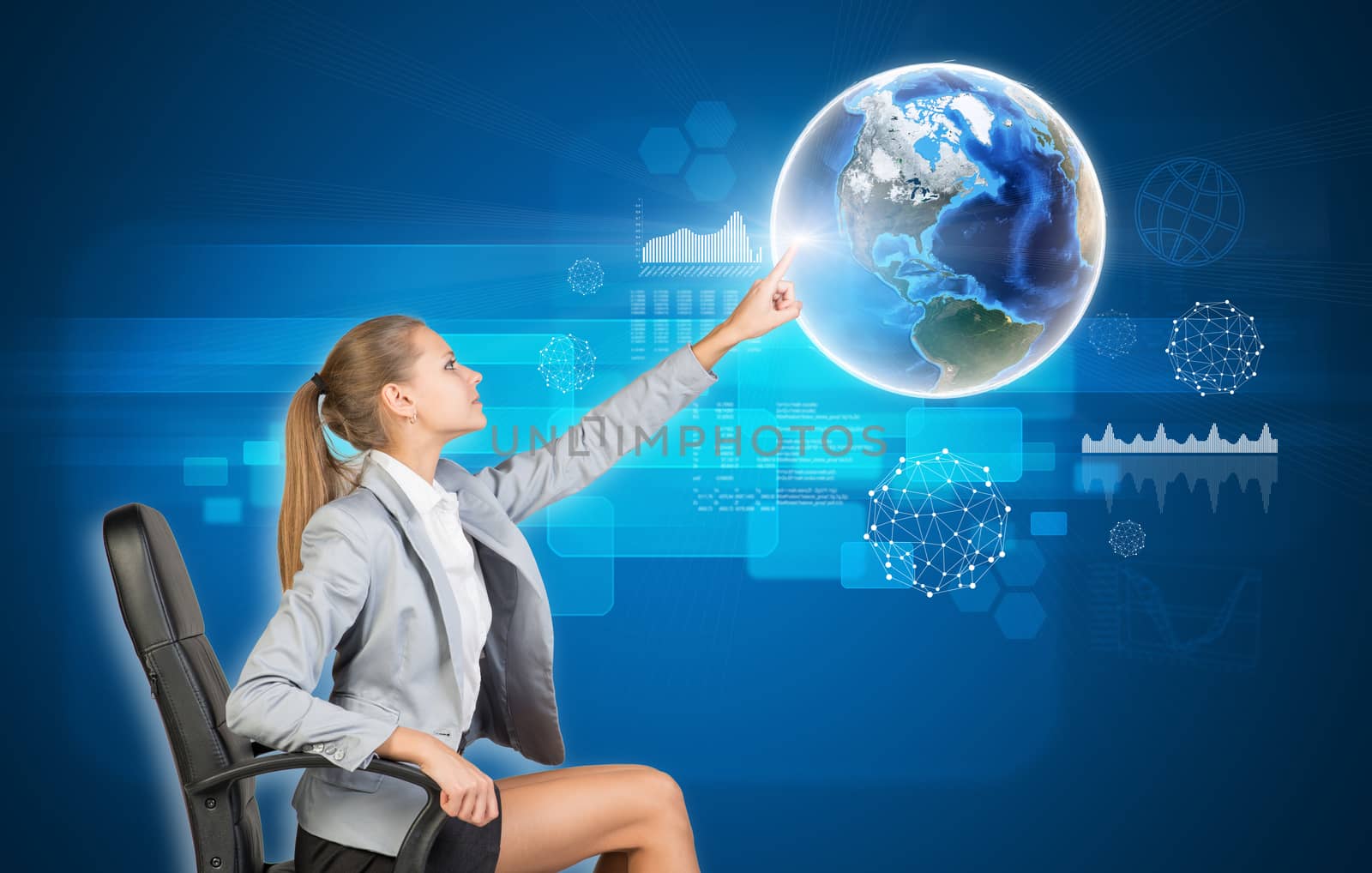 Businesswoman using virtual interface with Globe on blue background. Element of this image furnished by NASA