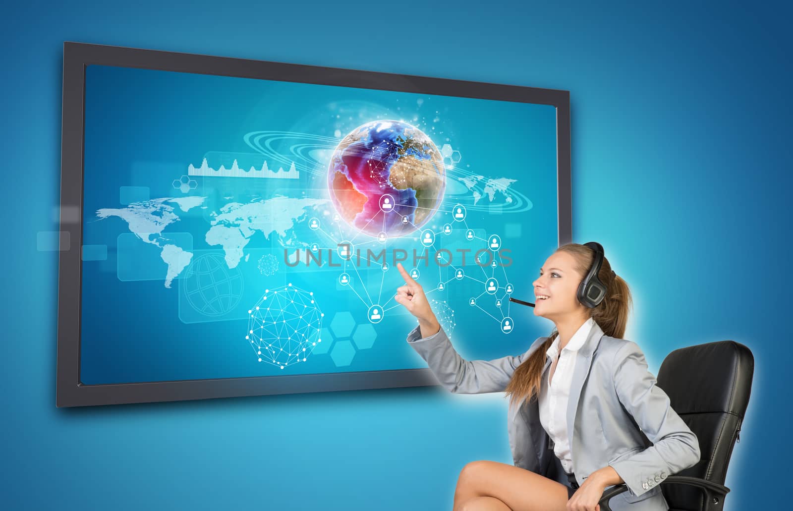 Businesswoman in headset using touch screen interface by cherezoff
