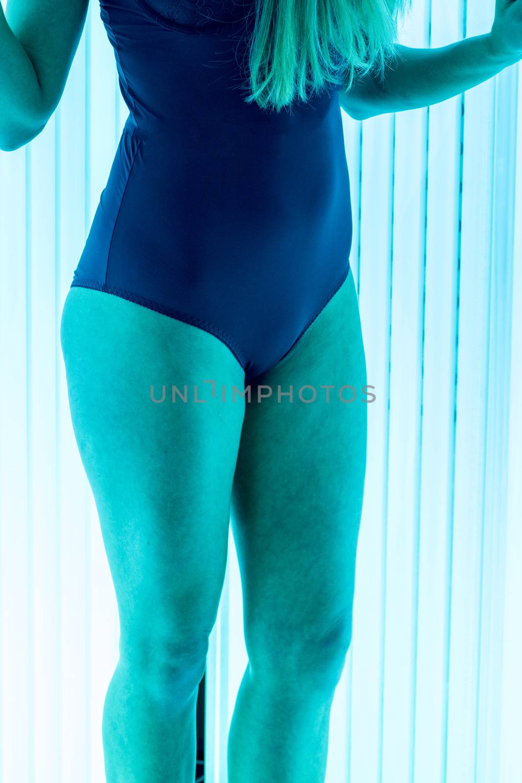 beautiful girl closeup in swimsuit at solarium