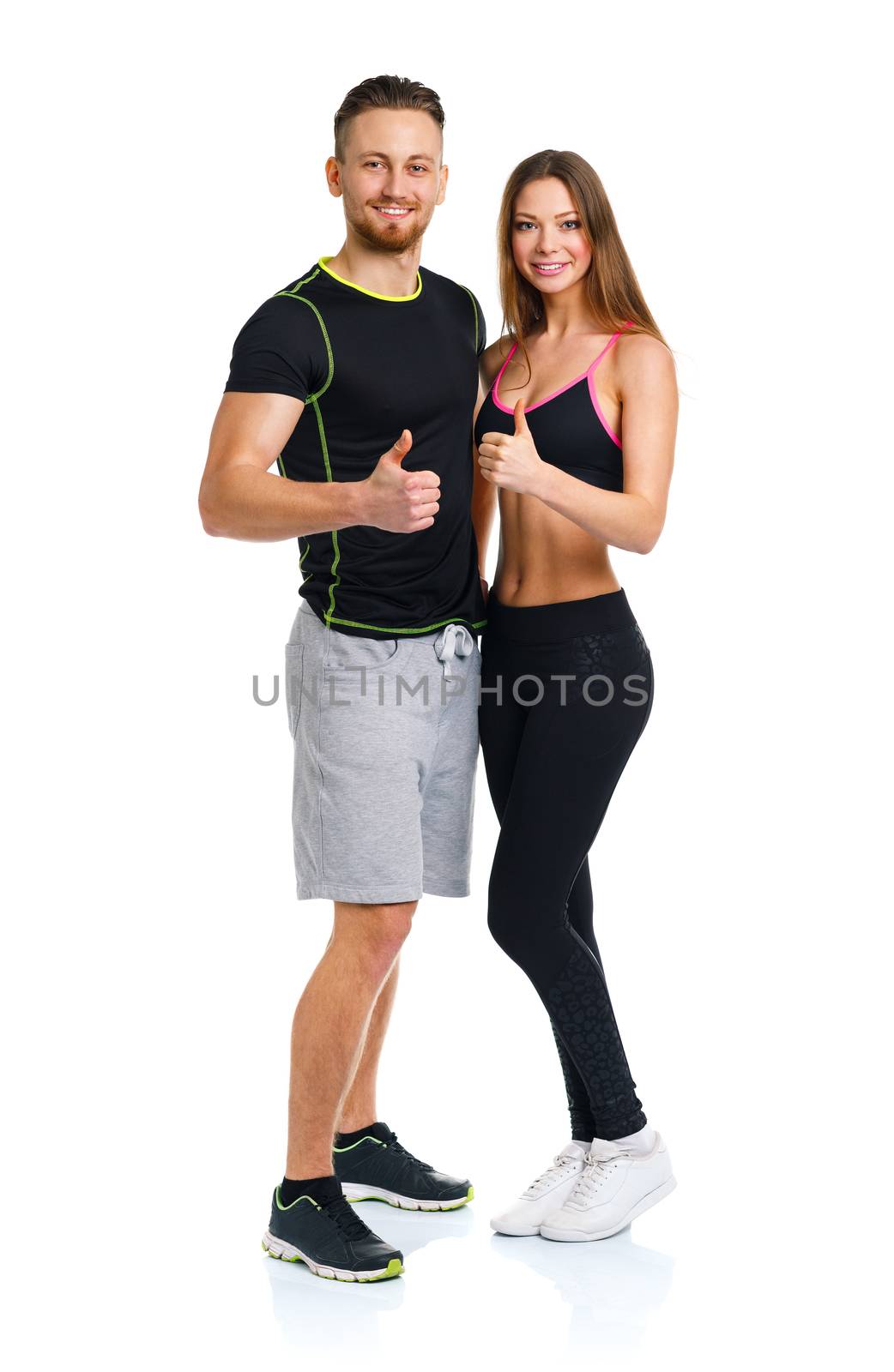 Sport man and woman after fitness exercise with a finger up on the white background