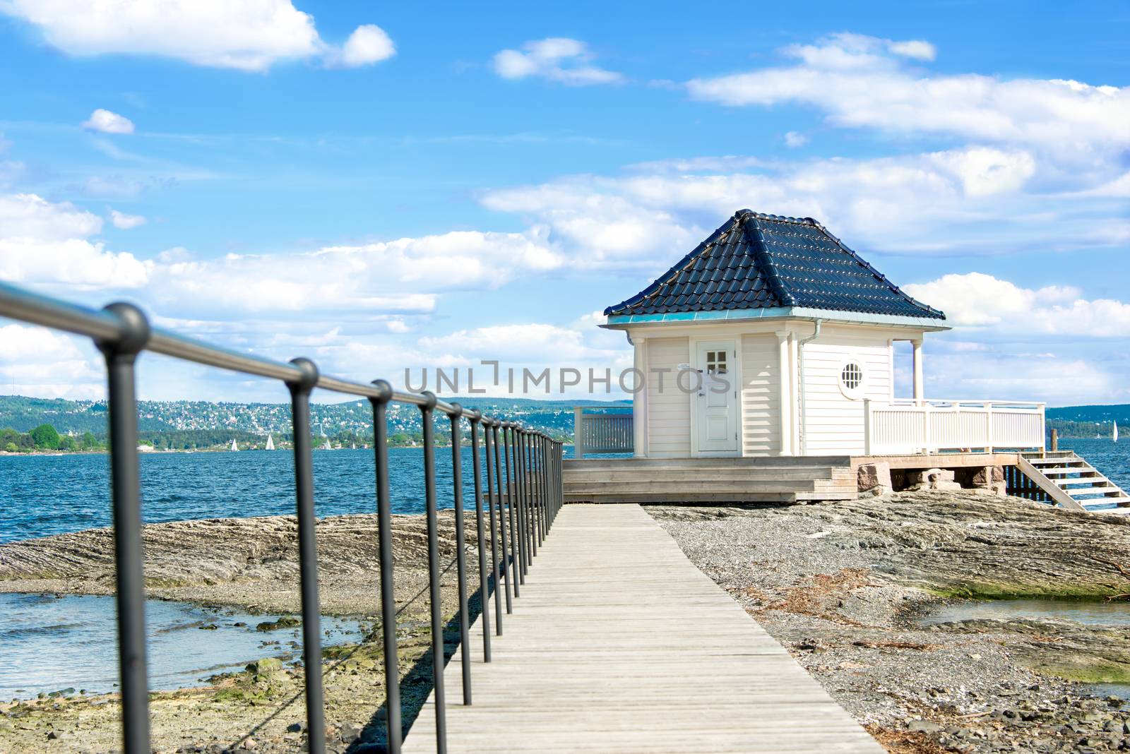 Lone standing small house and pathway on Oslo fjord