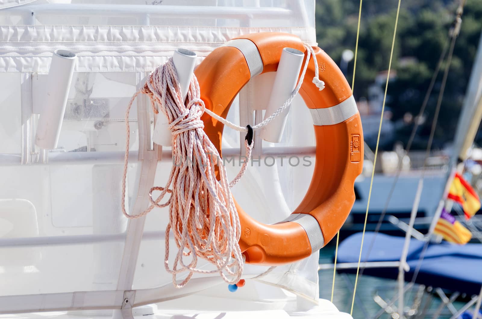 Personal flotation device on yacht aft with rope